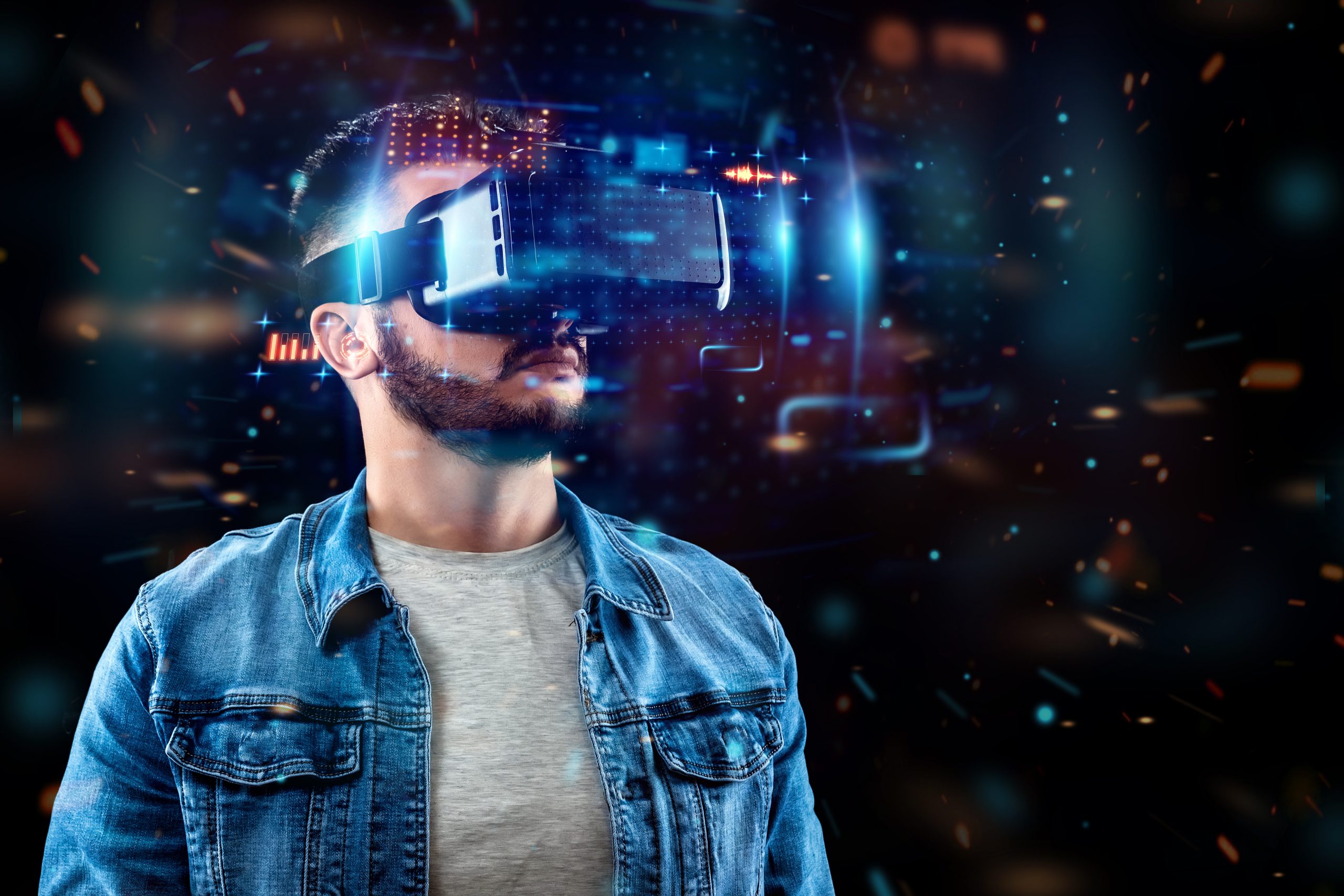 Portrait of a man with glasses of virtual reality, vr, interacts with a virtual screen. The concept of the future is here, applications complement reality, the interface of virtual reality